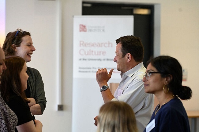 People chatting at a conference.
